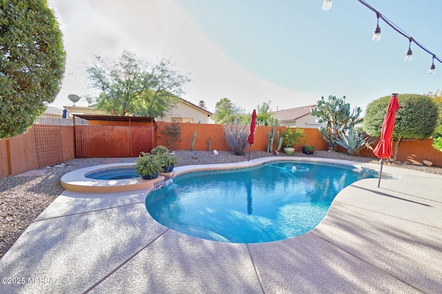 view of pool featuring an in ground hot tub and a patio area