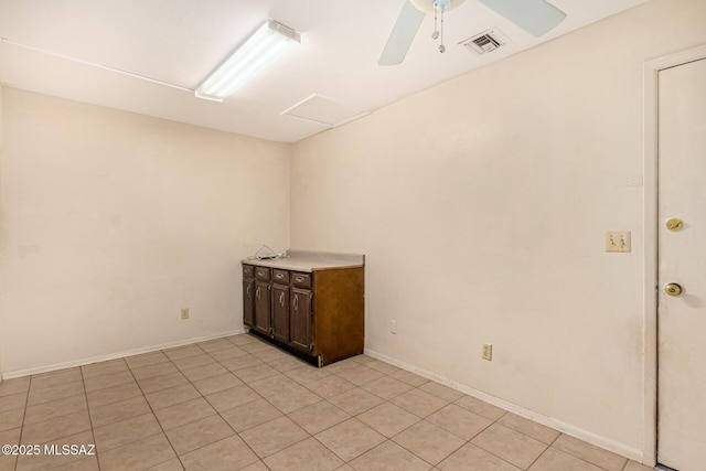 unfurnished room with ceiling fan