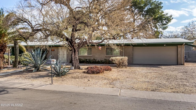 ranch-style home with a garage