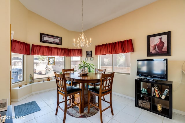 tiled dining area with a chandelier and vaulted ceiling