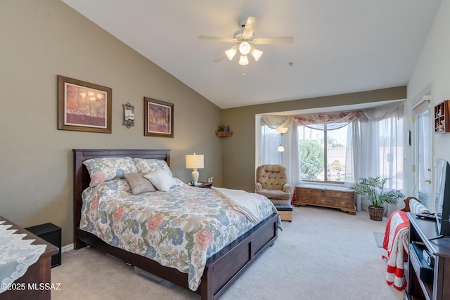 bedroom with lofted ceiling, light colored carpet, and ceiling fan