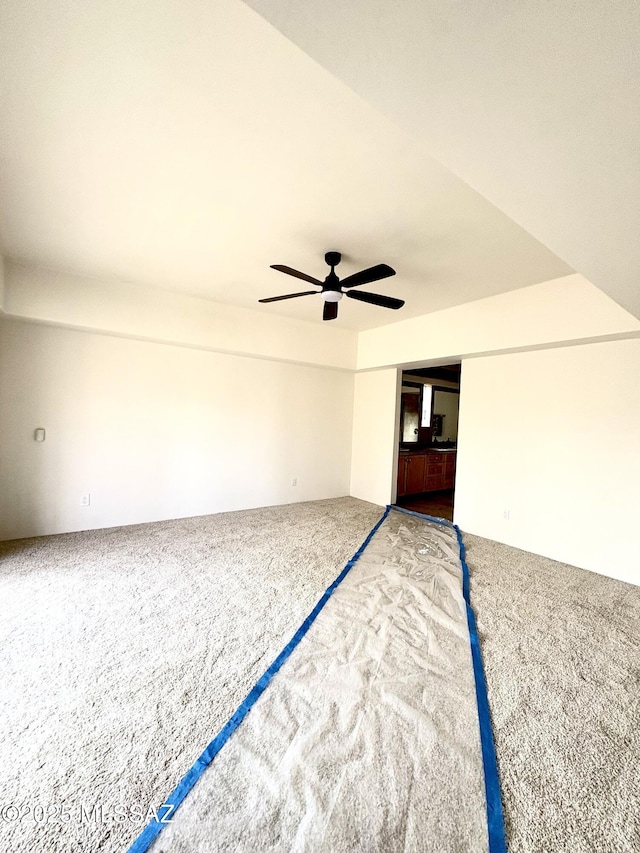 interior space with ceiling fan