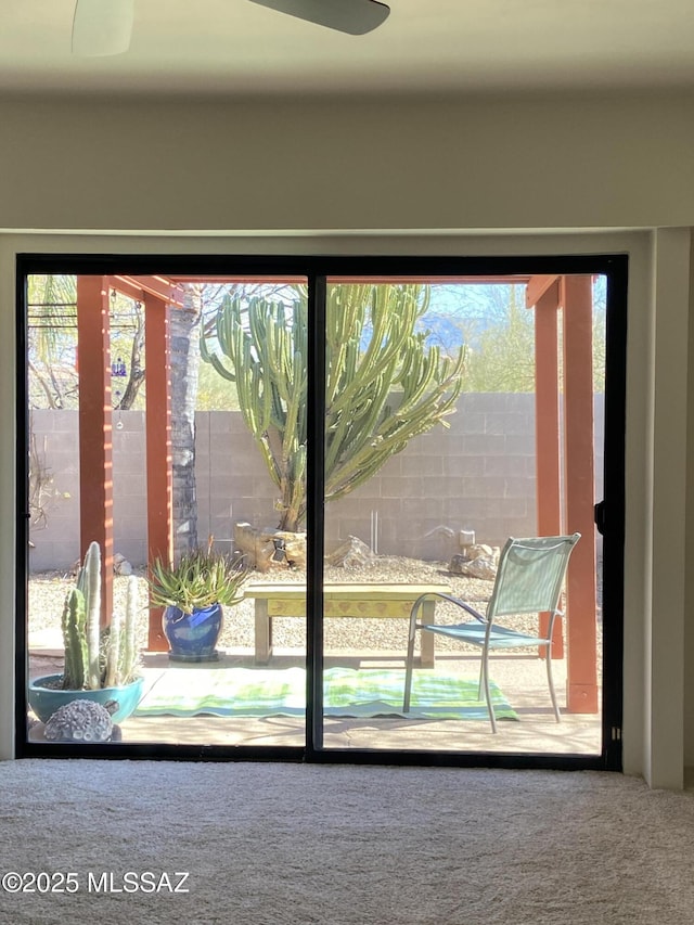 doorway featuring carpet floors