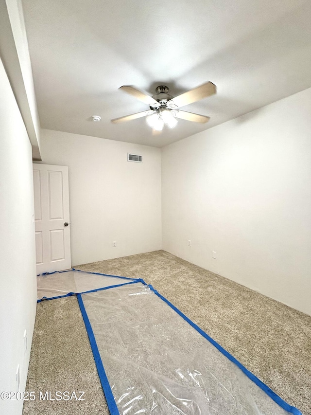 unfurnished room featuring ceiling fan