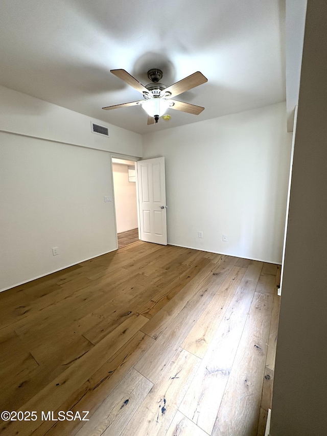 unfurnished room featuring wood-type flooring and ceiling fan