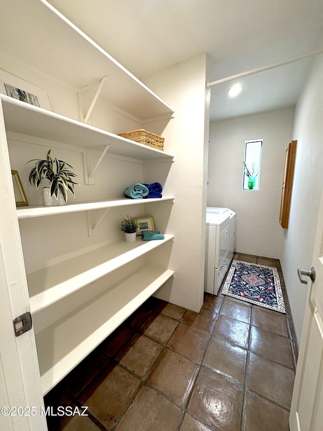 bathroom featuring washing machine and dryer and vanity