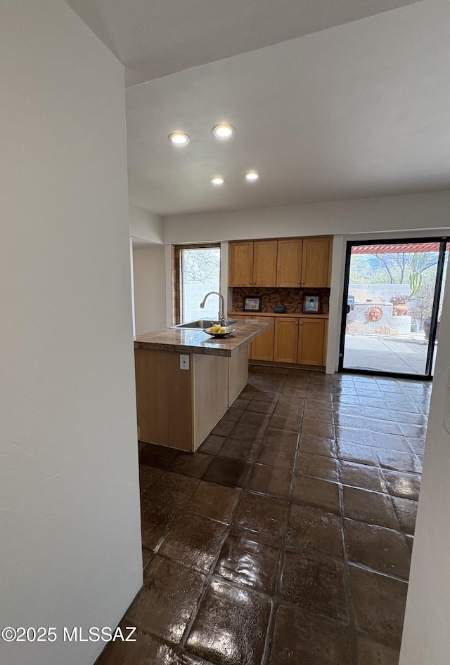 kitchen featuring sink and decorative backsplash