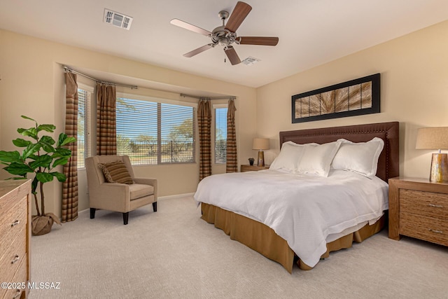 bedroom featuring light carpet and ceiling fan