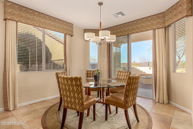60782 E Arroyo Vista Dr, Oracle, AZ 85623 - dining area with an inviting chandelier, a wealth of natural light, baseboards, and visible vents