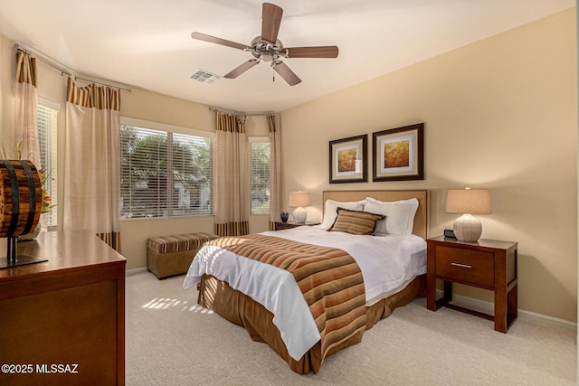 bedroom with light carpet and ceiling fan