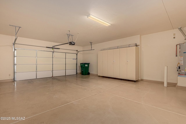 garage with a garage door opener and water heater