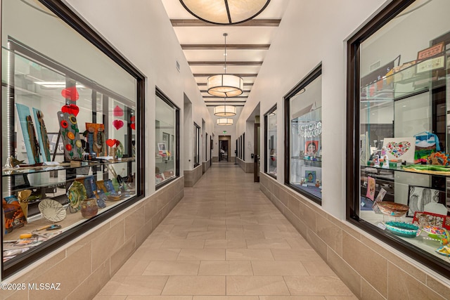 hall featuring light tile patterned flooring