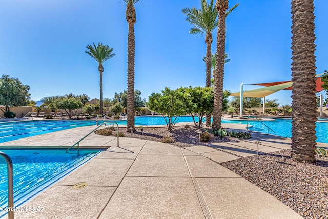 view of swimming pool featuring a patio