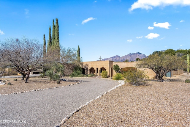 view of front of property with a mountain view