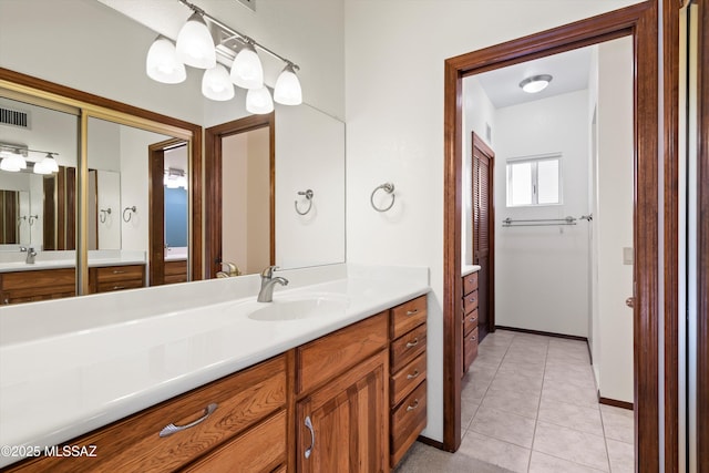 bathroom with vanity and tile patterned floors