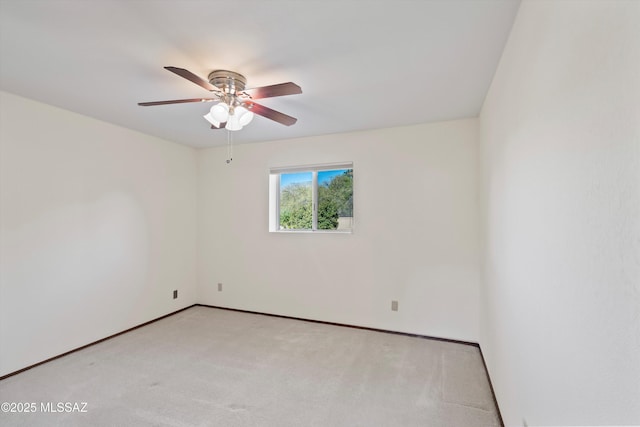 empty room with light carpet and ceiling fan