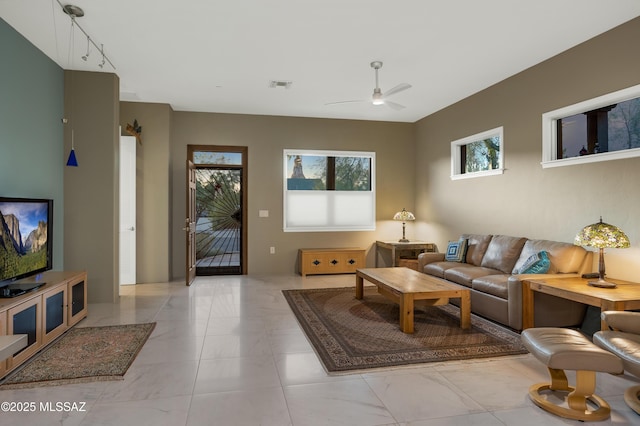 living room with rail lighting and ceiling fan