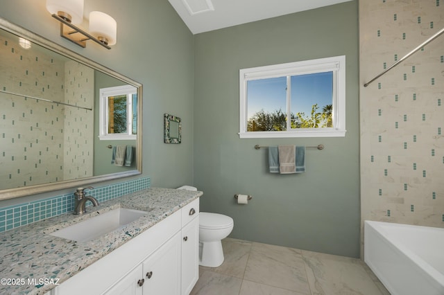 bathroom with vanity, backsplash, and toilet