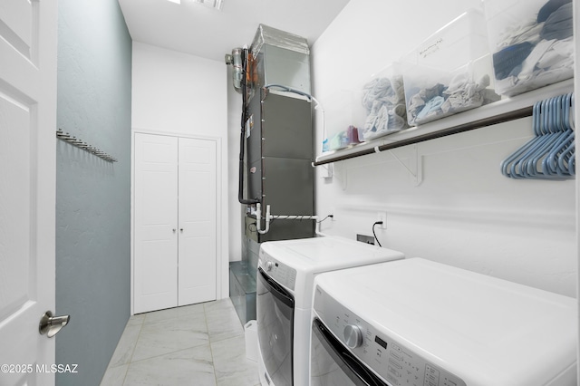 clothes washing area with washer and dryer