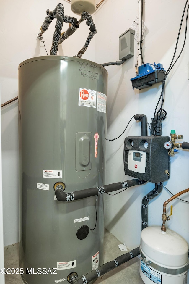 utility room featuring water heater