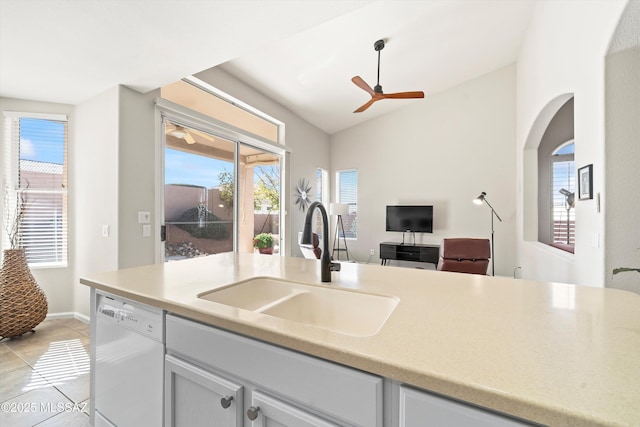 kitchen featuring sink, a healthy amount of sunlight, vaulted ceiling, and dishwasher