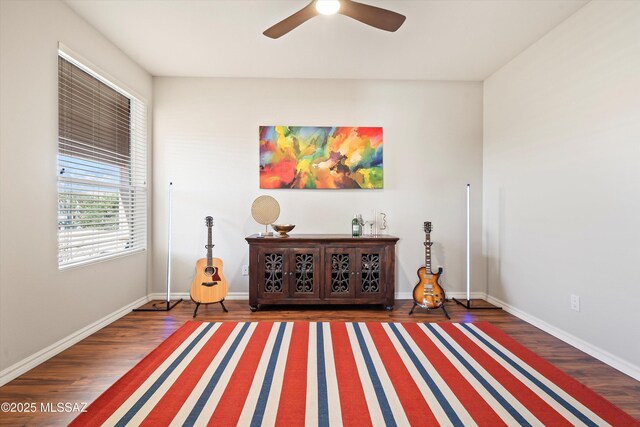 office area featuring ceiling fan, dark wood-type flooring, and french doors