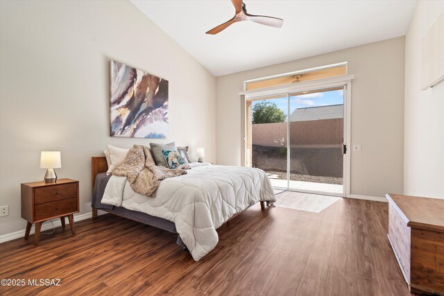 bedroom featuring ceiling fan, dark hardwood / wood-style floors, and lofted ceiling