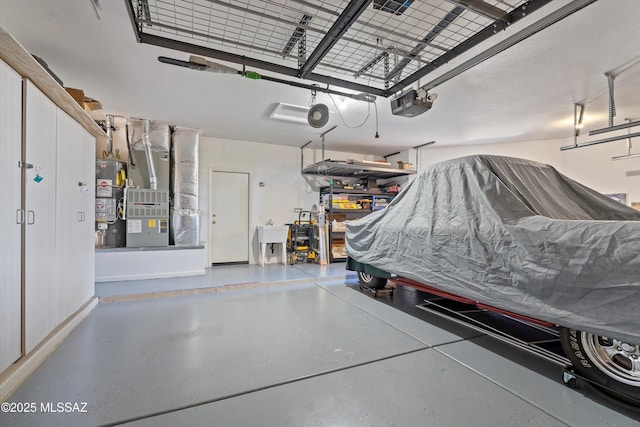 garage featuring a garage door opener, gas water heater, heating unit, and sink