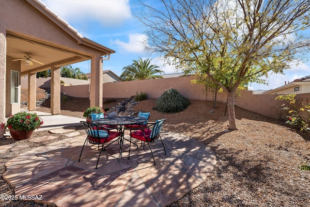 view of patio featuring ceiling fan