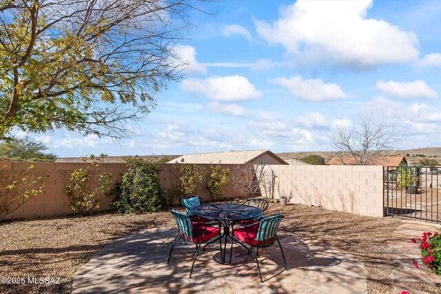 view of patio with an outdoor fire pit