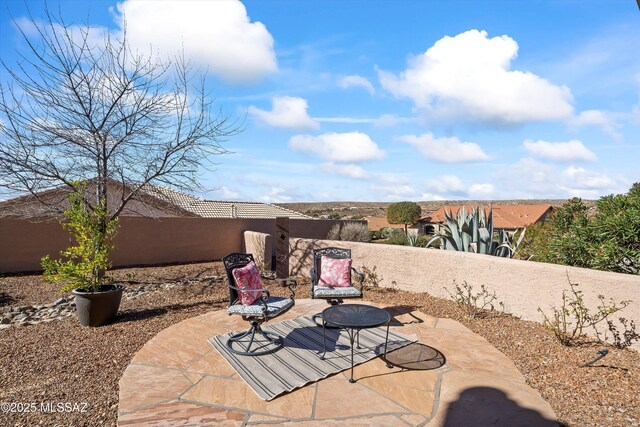 rear view of property featuring a patio