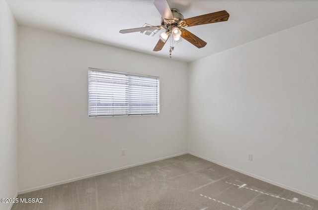 unfurnished room featuring ceiling fan and light carpet