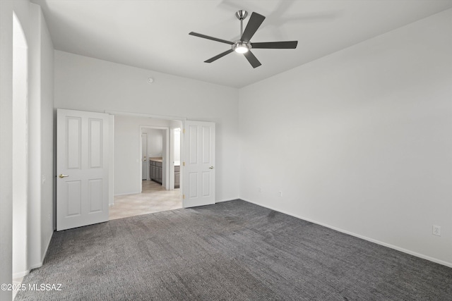 unfurnished bedroom with baseboards, carpet floors, and ceiling fan