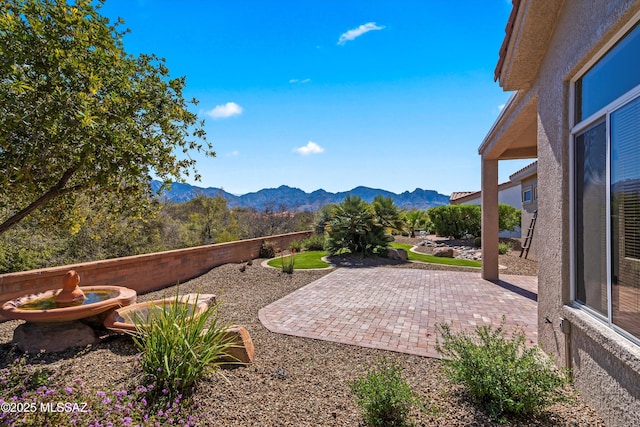 view of patio / terrace with a mountain view