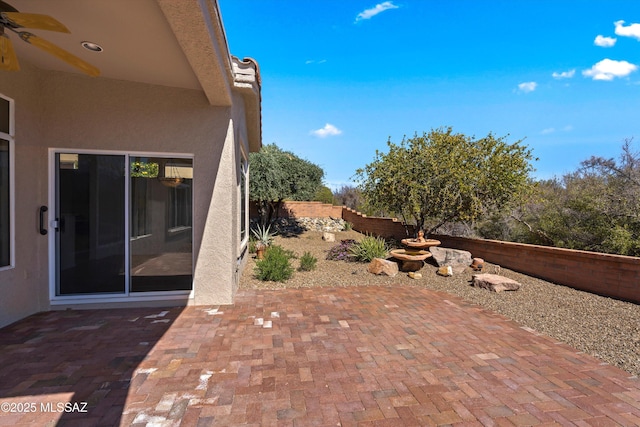 view of patio / terrace featuring fence