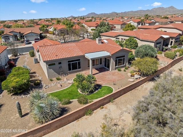 birds eye view of property with a mountain view and a residential view