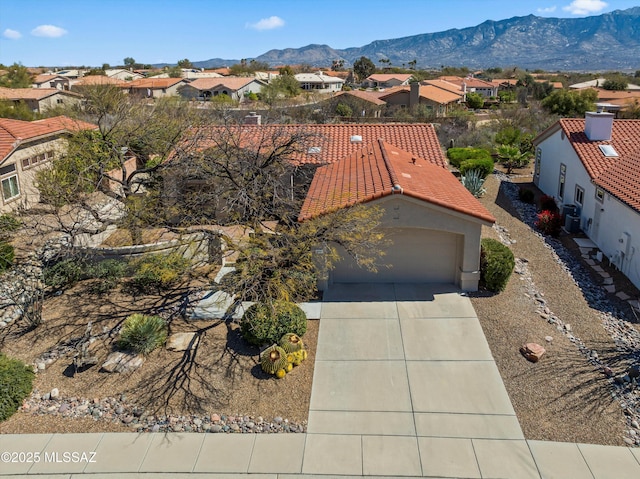 birds eye view of property featuring a mountain view and a residential view