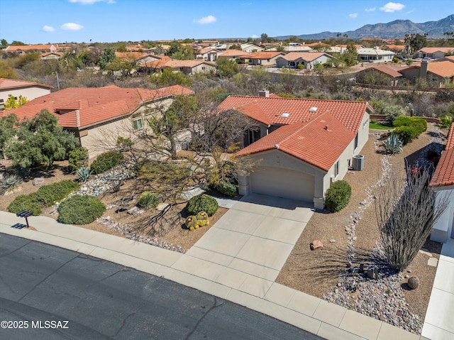 bird's eye view featuring a residential view and a mountain view