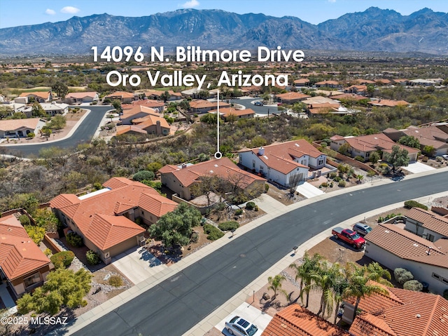 drone / aerial view with a mountain view and a residential view