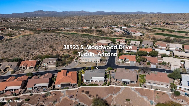 drone / aerial view with a residential view and a mountain view