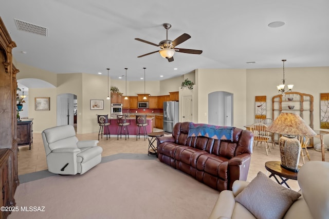 3534 E Sweet Grass Trl, Sahuarita, AZ 85629 - living room featuring arched walkways, a chandelier, ceiling fan, and recessed lighting