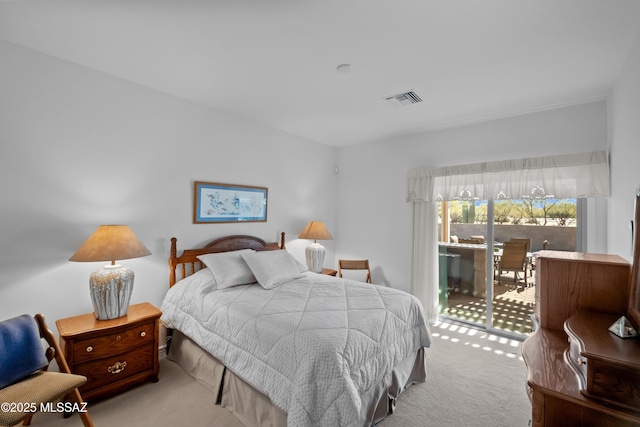 carpeted bedroom featuring access to outside