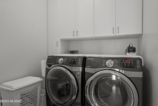 washroom with cabinets and independent washer and dryer