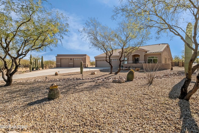 3534 E Sweet Grass Trl, Sahuarita, AZ 85629 - mediterranean / spanish house featuring driveway, a tiled roof, stucco siding, and a garage