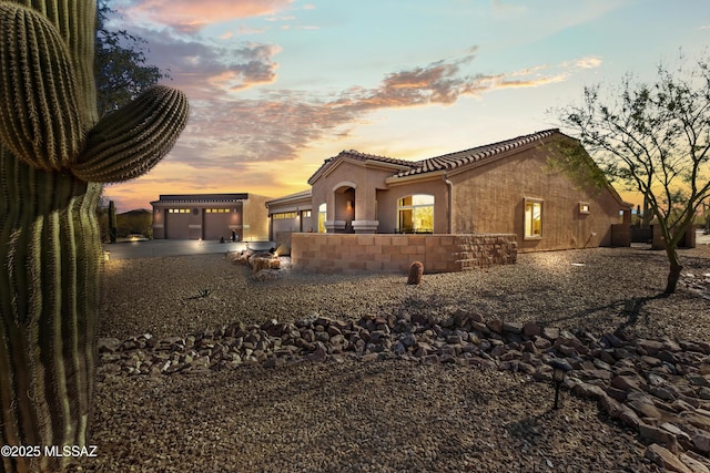3534 E Sweet Grass Trl, Sahuarita, AZ 85629 - view of front of property with driveway, a tile roof, a garage, and stucco siding