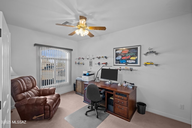 carpeted home office with ceiling fan