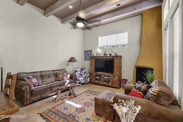 tiled living room with beamed ceiling and ceiling fan