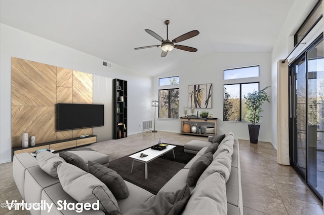 living room with a wealth of natural light, high vaulted ceiling, and ceiling fan