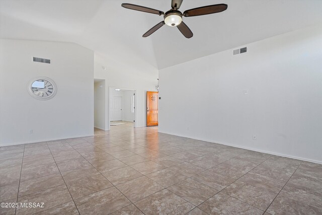 empty room featuring light tile patterned flooring, ceiling fan, and high vaulted ceiling