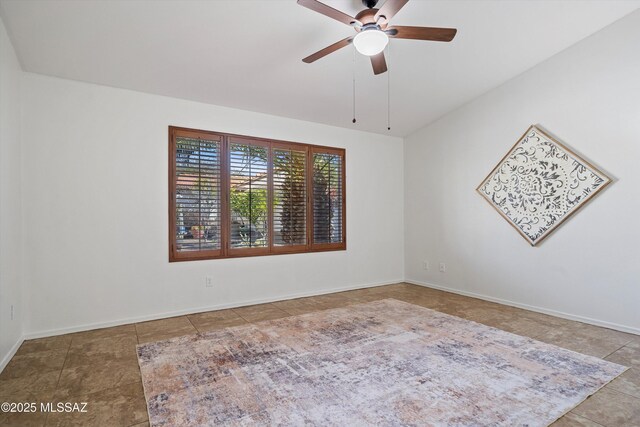 spare room with ceiling fan